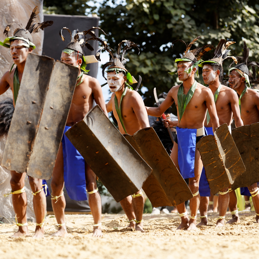 Performers from the Yimkhiung (formerly known as Yimchunger) tribe of Nagaland performing a traditional dance during the Hornbill Festival.