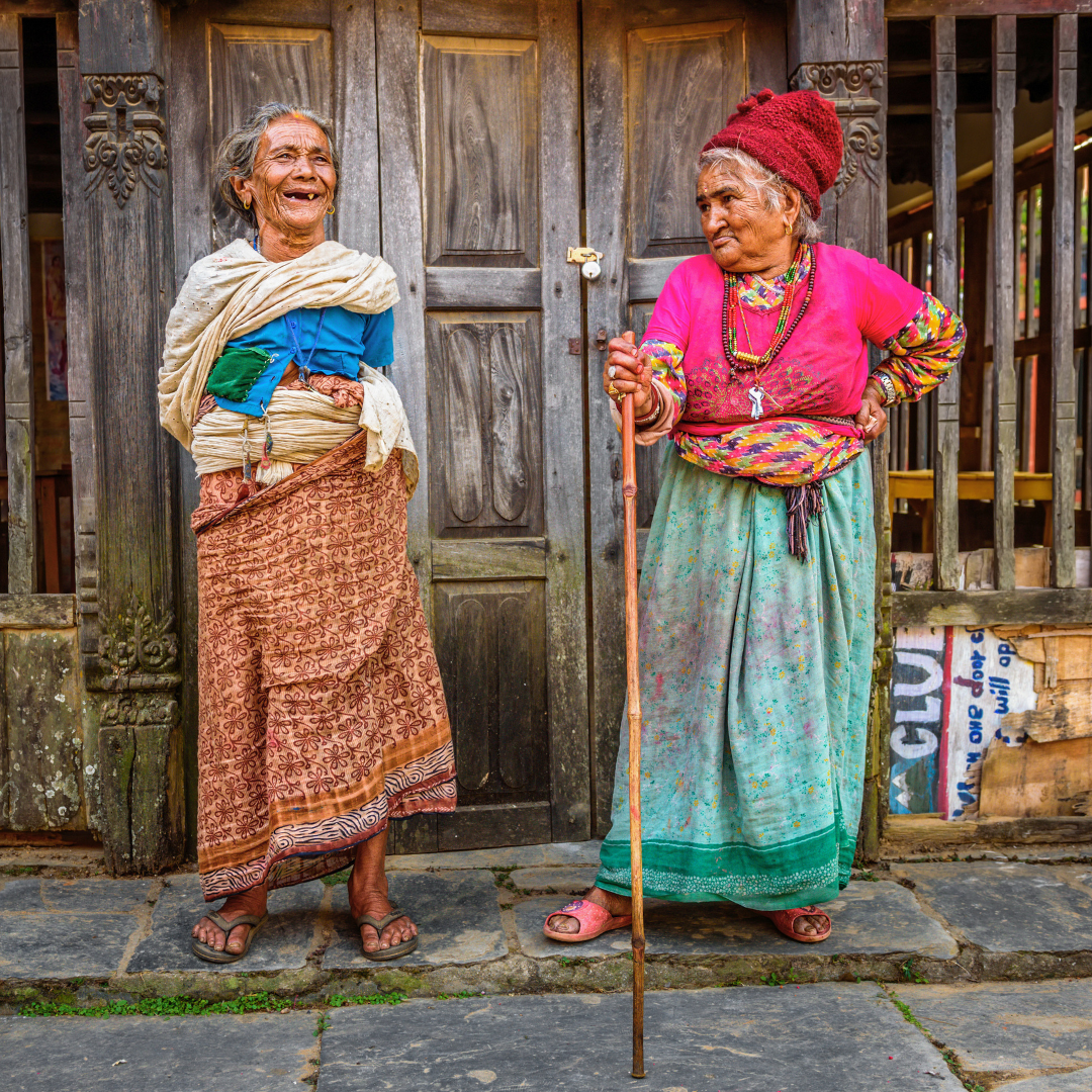 Two Gurung women in traditional dress in a rural Nepalese village