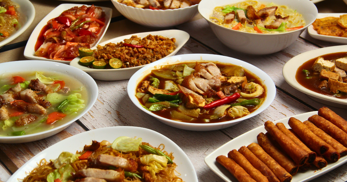 Filipino dishes served together on a dining table in Manila