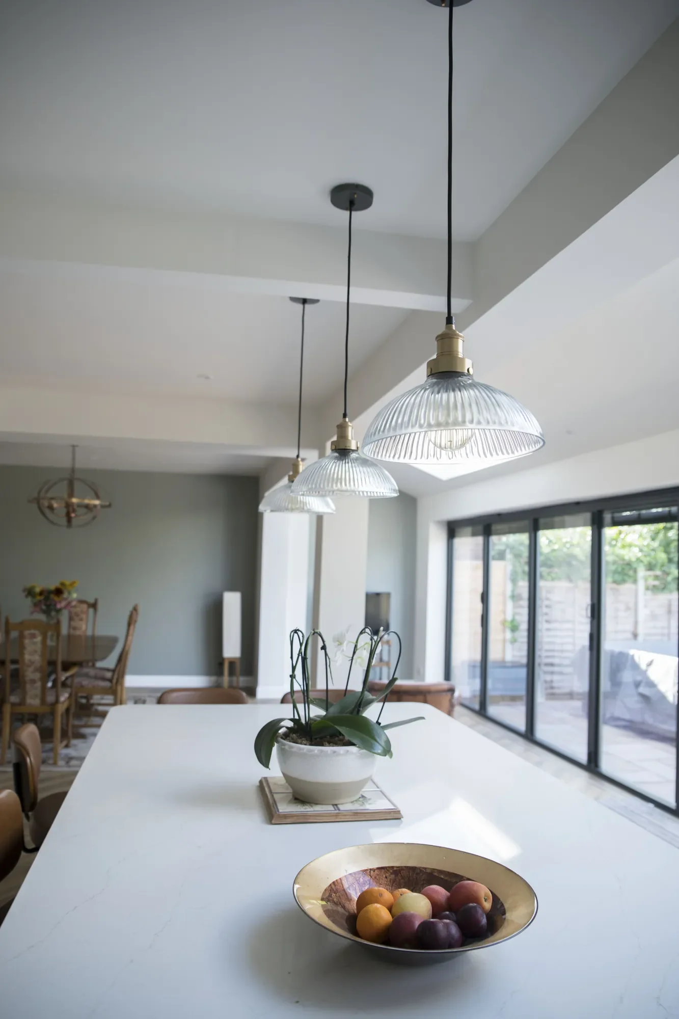 kitchen-extension-04-glass-pendant-lights-over-island.webp