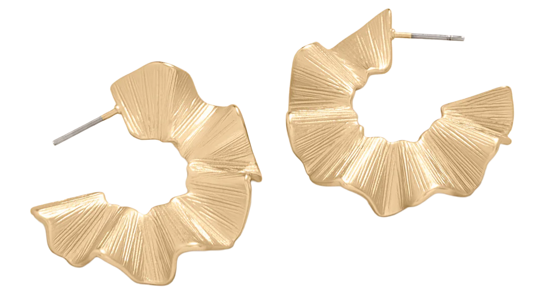 Close-up of women's gold hoop earrings with a geometric, pleated design.
