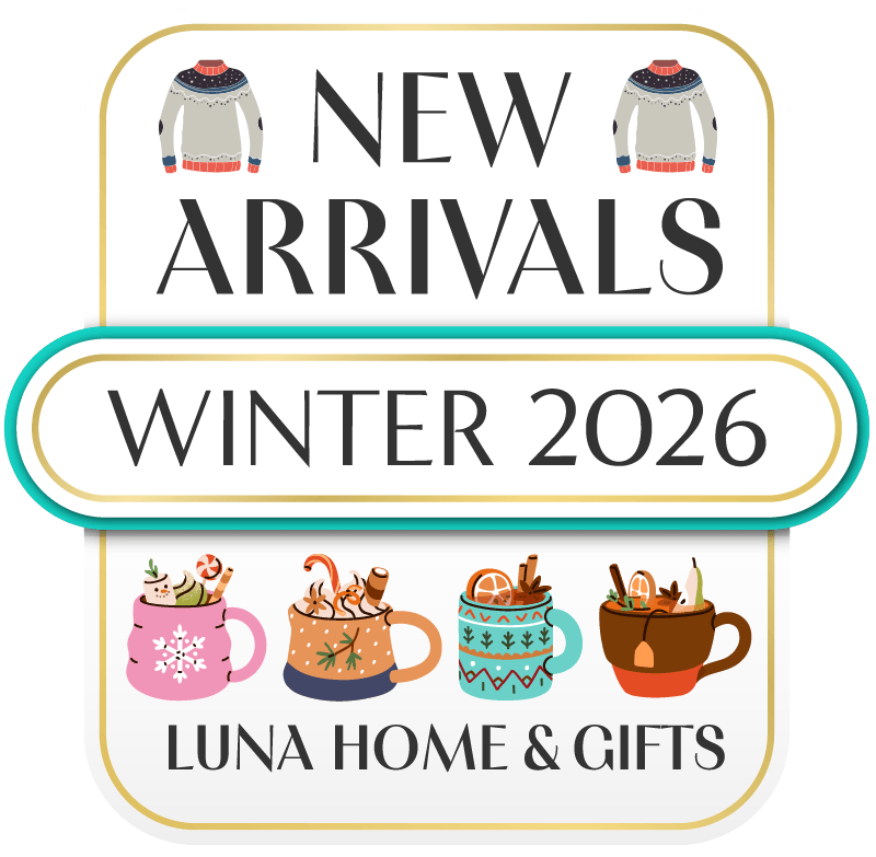 A promotional graphic for Luna Home & Gifts featuring new winter 2026 arrivals. The design includes illustrations of cozy sweaters and festive mugs with holiday-themed drinks and decorations.