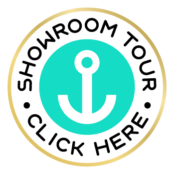 Showroom Tour Click Here badge with a circular design, featuring an anchor icon in the center, black text, and a gold border.