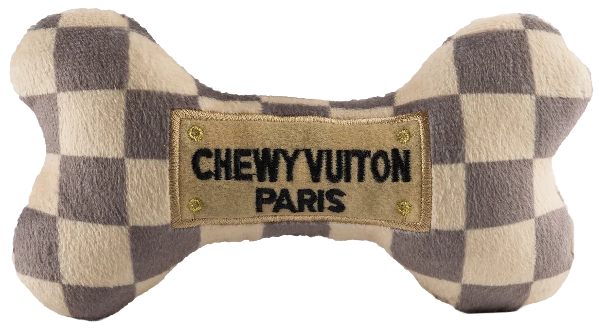A plush bow tie with a checkered pattern and a label that reads "CHEWYVUITON PARIS".
