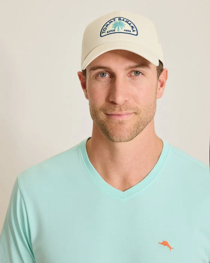Man wearing a beige cap and light blue shirt