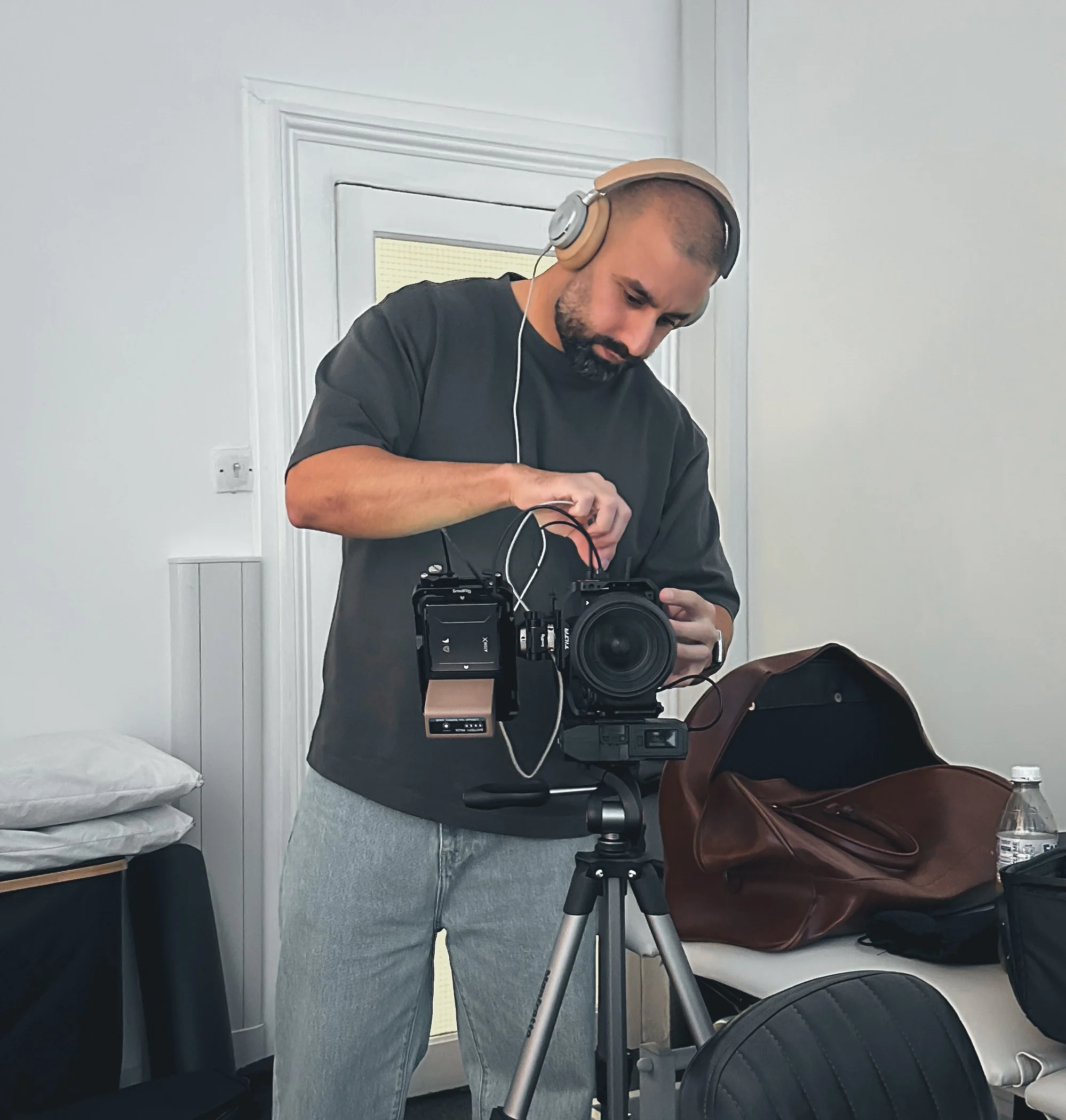 Qissa Founder, Zohaib, finishing the final touches on a vertical camera rig set up, before a shoot.