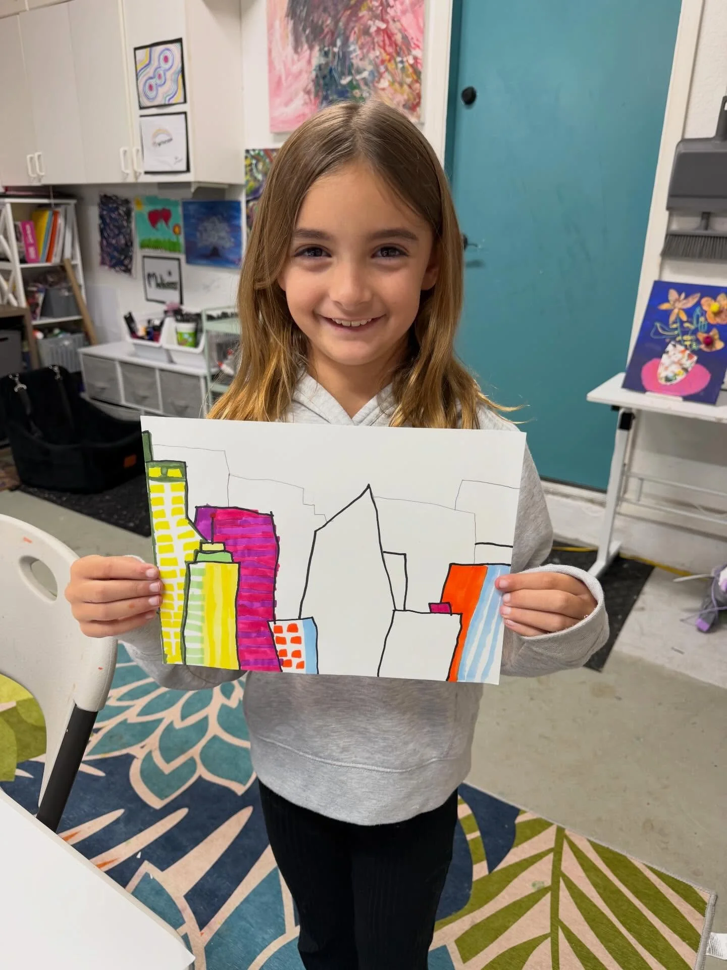 This week in Art Explorers, we turned simple lines into bold cityscapes 🏙️
We focused on building shapes, overlapping forms, and filling our buildings with color and pattern. Every skyline tells a different story&mdash;and no two look the same. So p