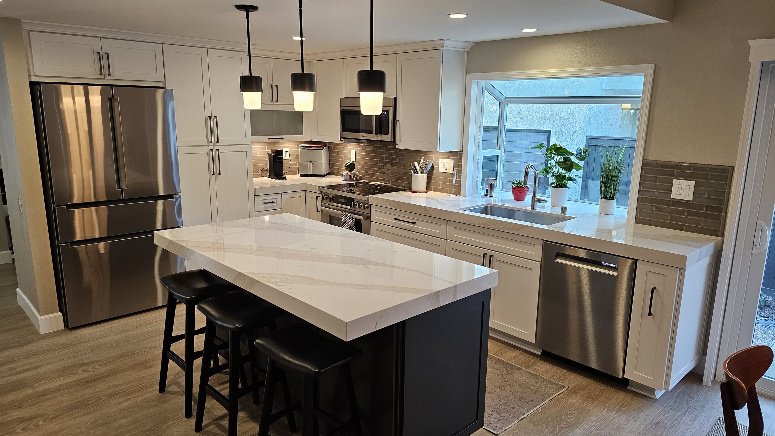 Funakoshi Transitional White Kitchen with Blue Island & Sleek Finishes