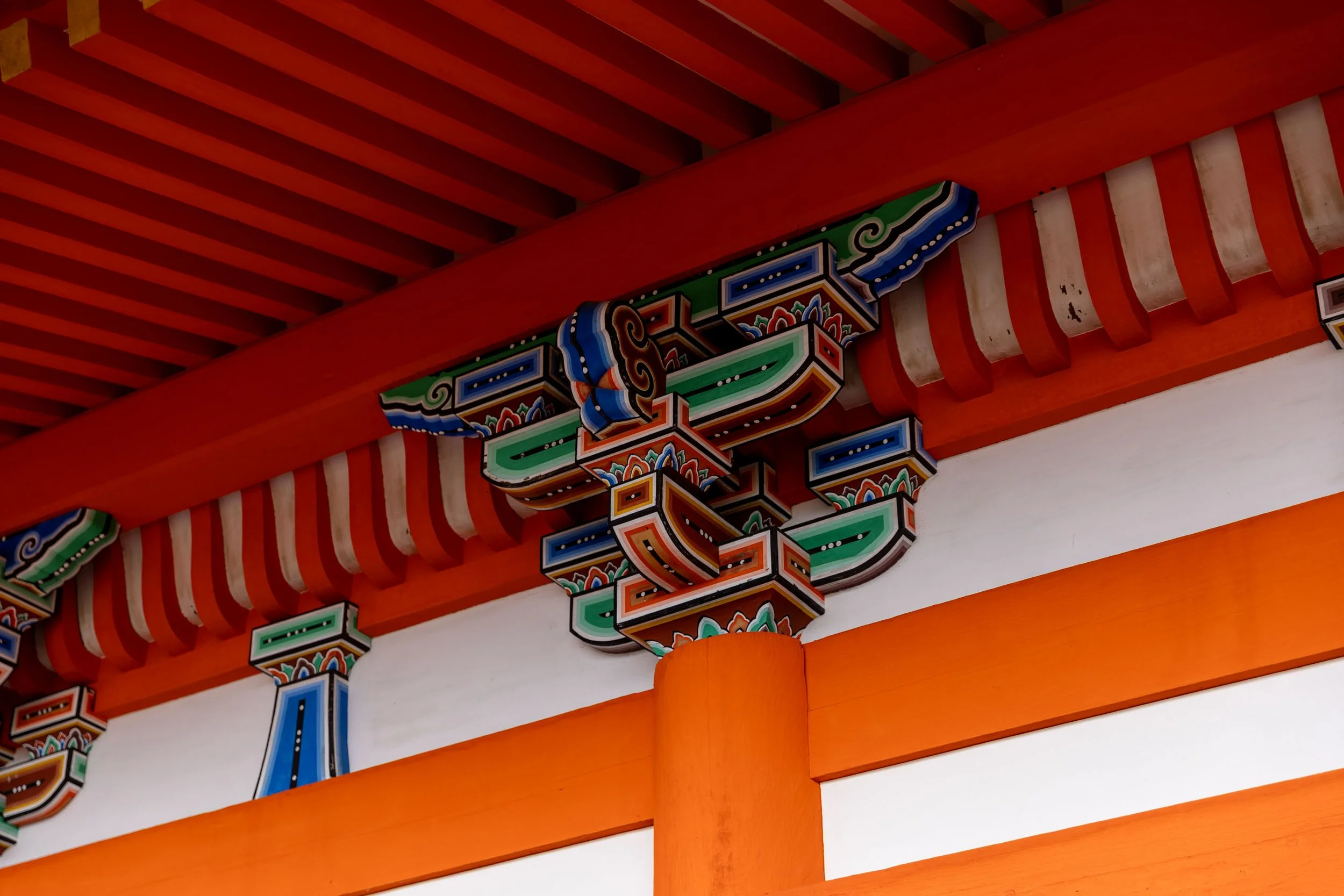 Traditional Japanese architectural details with vibrant colors and intricate carvings
