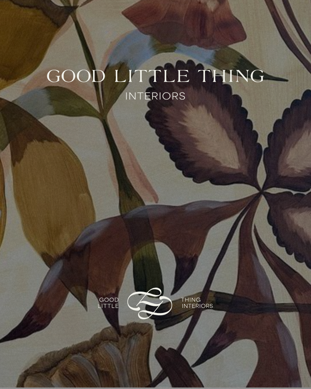 Close-up of a leaf-patterned fabric or wallpaper with text overlay that reads 'Good Little Thing Interiors'.