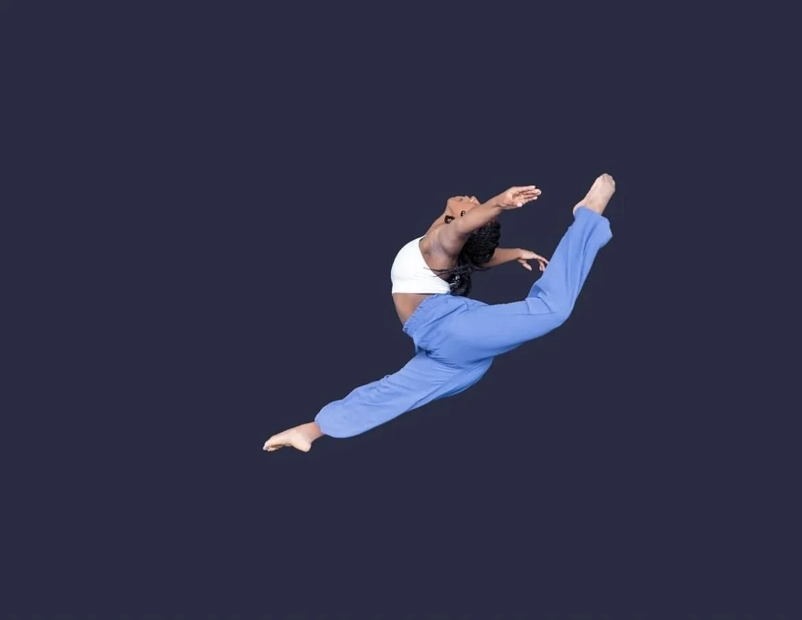 A woman in athletic clothes performing a high jump or gymnastics move against a dark background.