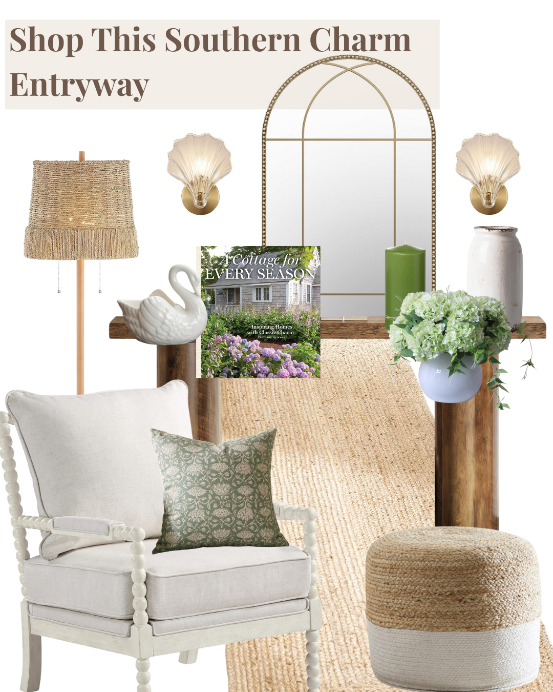 Decorative interior entryway with a large mirror, wall sconces, a lamp, floral arrangements, a coffee table style wooden beam, a book titled "A Cottage for Every Season," and cozy seating including an upholstered armchair with pillows and a woven ottoman.