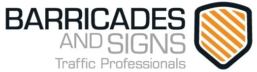 Logo for Barricades and Signs Traffic Professionals, featuring black and gray text and a shield icon with orange stripes.
