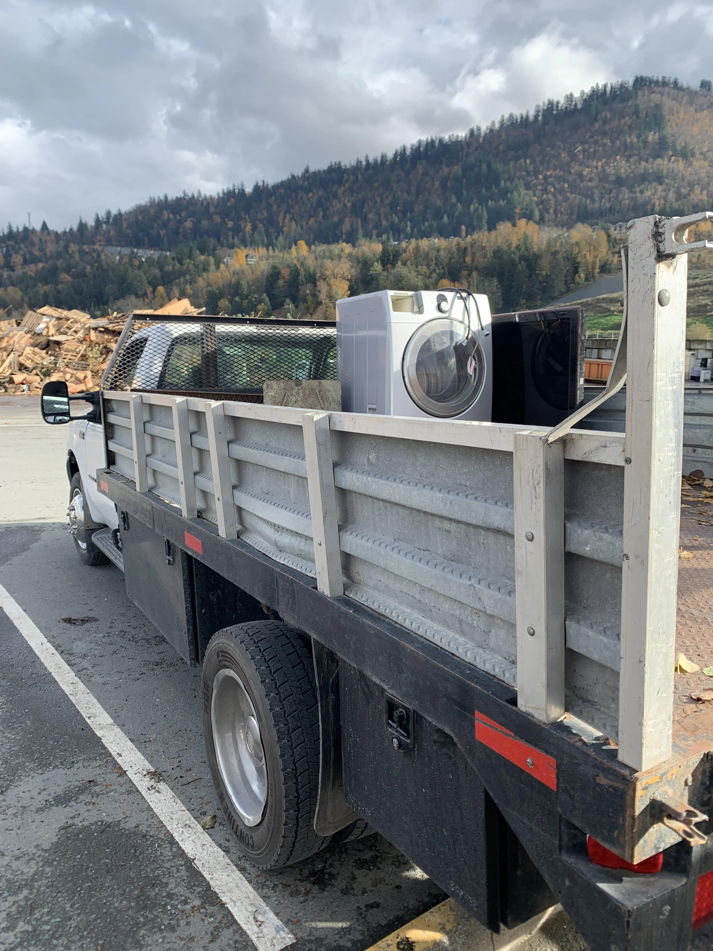 Junk Removal team from Trashthis loading furniture and appliances in Chilliwack, Abbotsford, Langley and Surrey, BC.