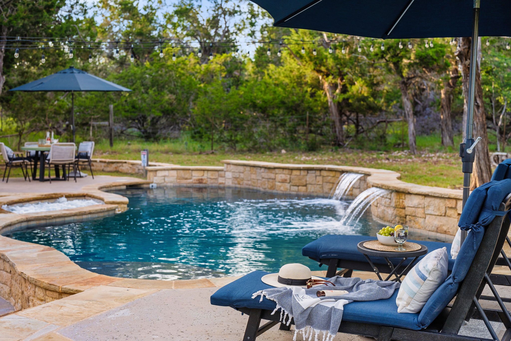 Relax poolside in comfort & style. Waterfall Pool & Spa in Cedar Park, Texas (just north of Austin, TX)