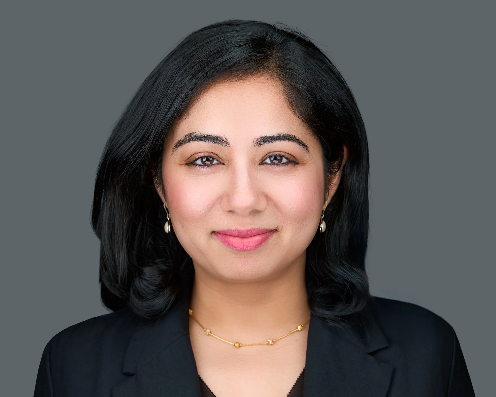 Healthcare Executive on grey background. Business headshot photographer Prosper Jessica Mills Photography