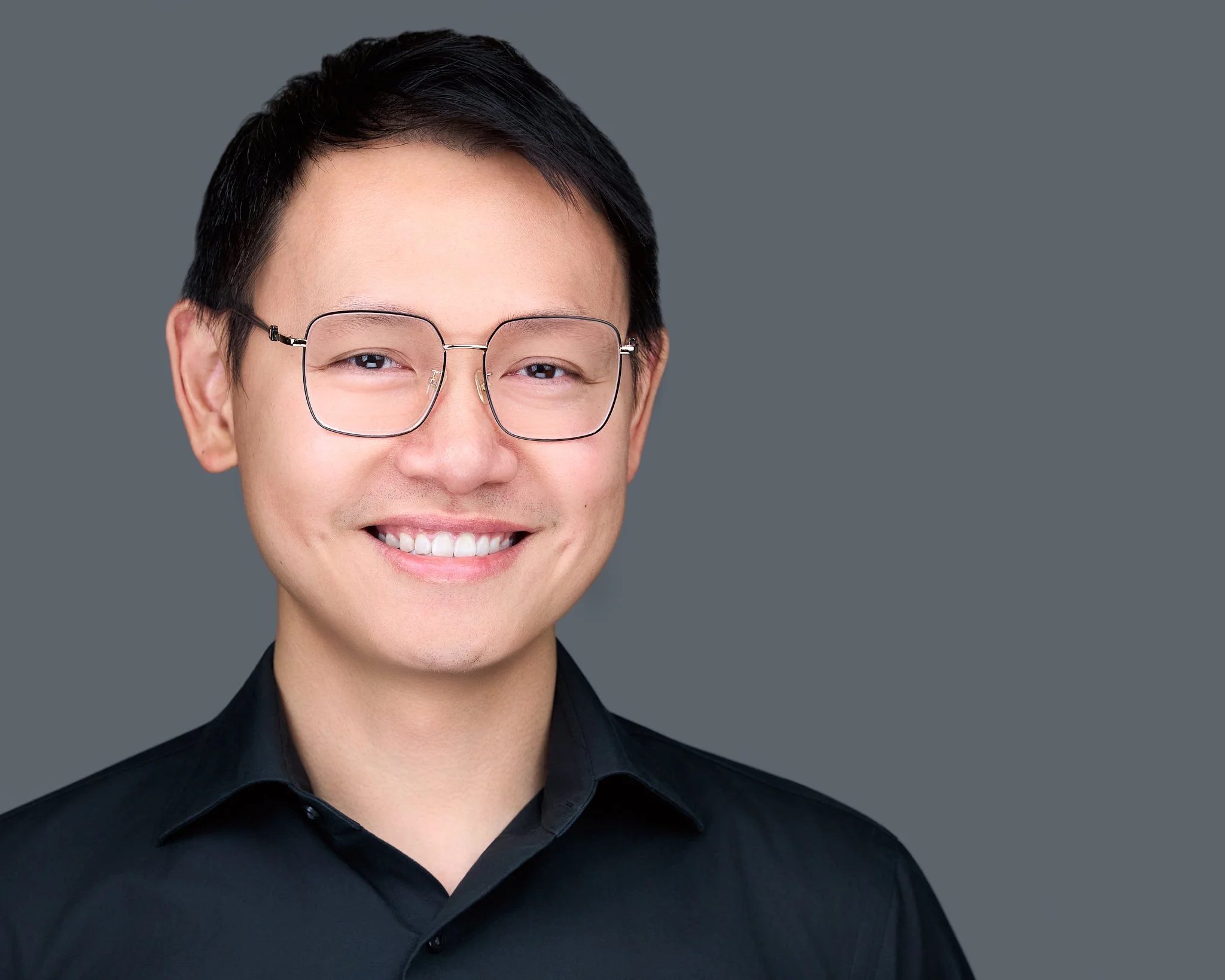 Healthcare executive headshot on grey background Richardson TX. Jessica Mills Photography