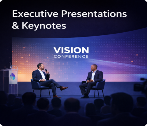 Two men speaking on stage during a conference titled 'Vision Conference,' with a large screen behind them displaying 'Executive Presentations & Keynotes.'