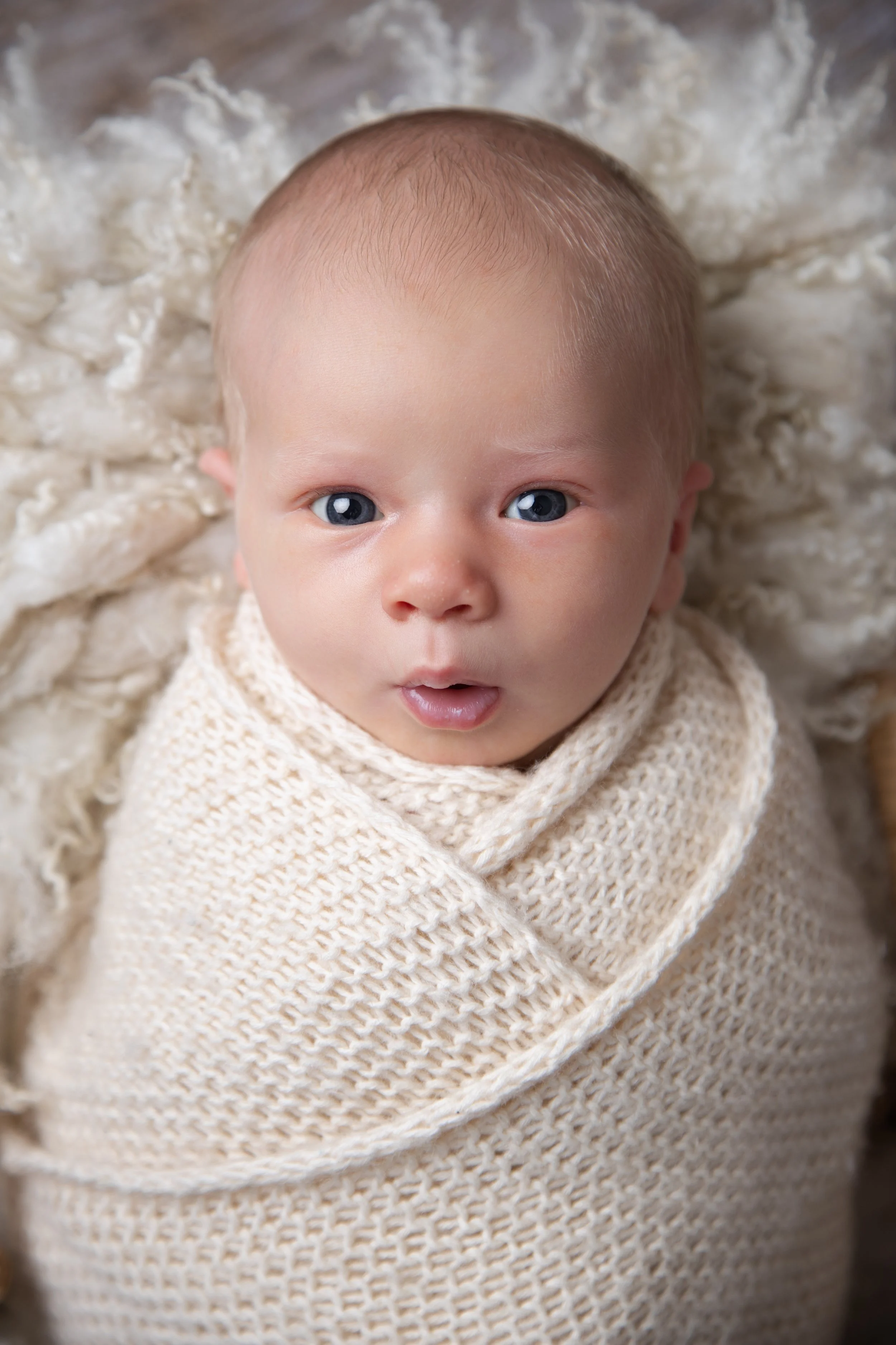 wide-eyed-newborn-baby-cream-wrap-newcastle.jpg