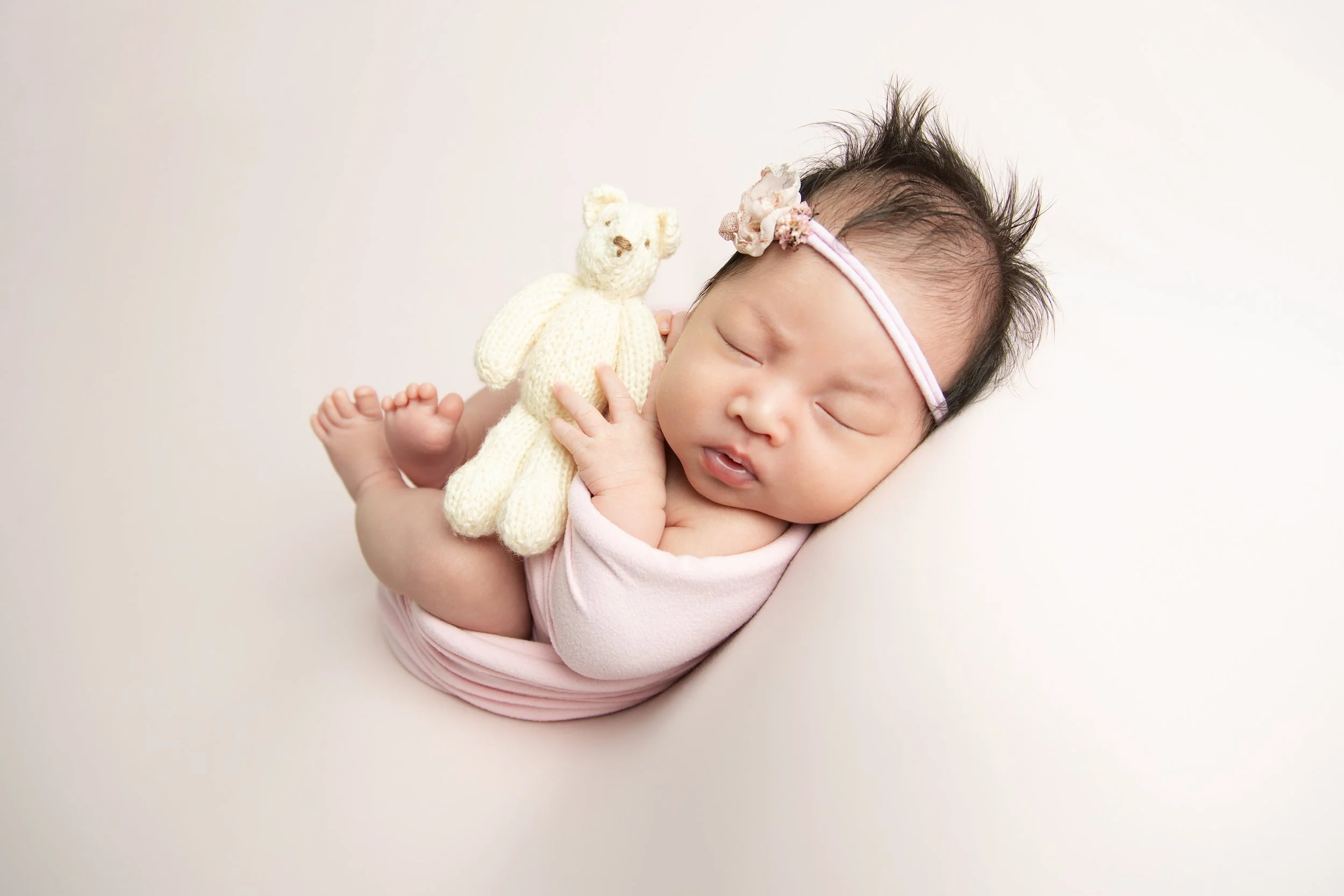 newborn-baby-girl-pink-wrap-teddy-newcastle.jpg