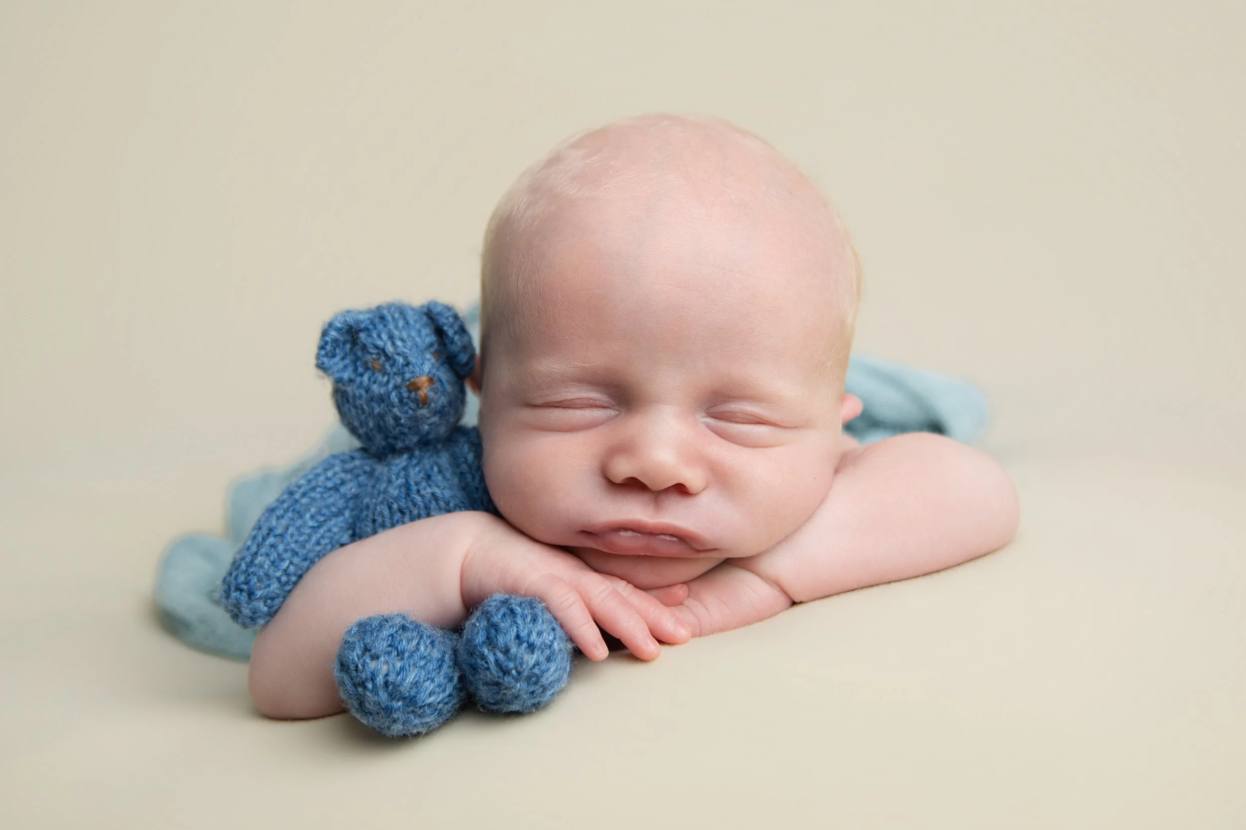 sleeping-newborn-baby-blue-teddy-neutral-newcastle.jpg