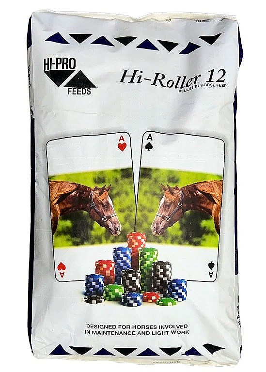 A white bag of Hi-Roller 12 pelleted horse feed featuring a design with two horses facing each other, poker chips, and playing cards.