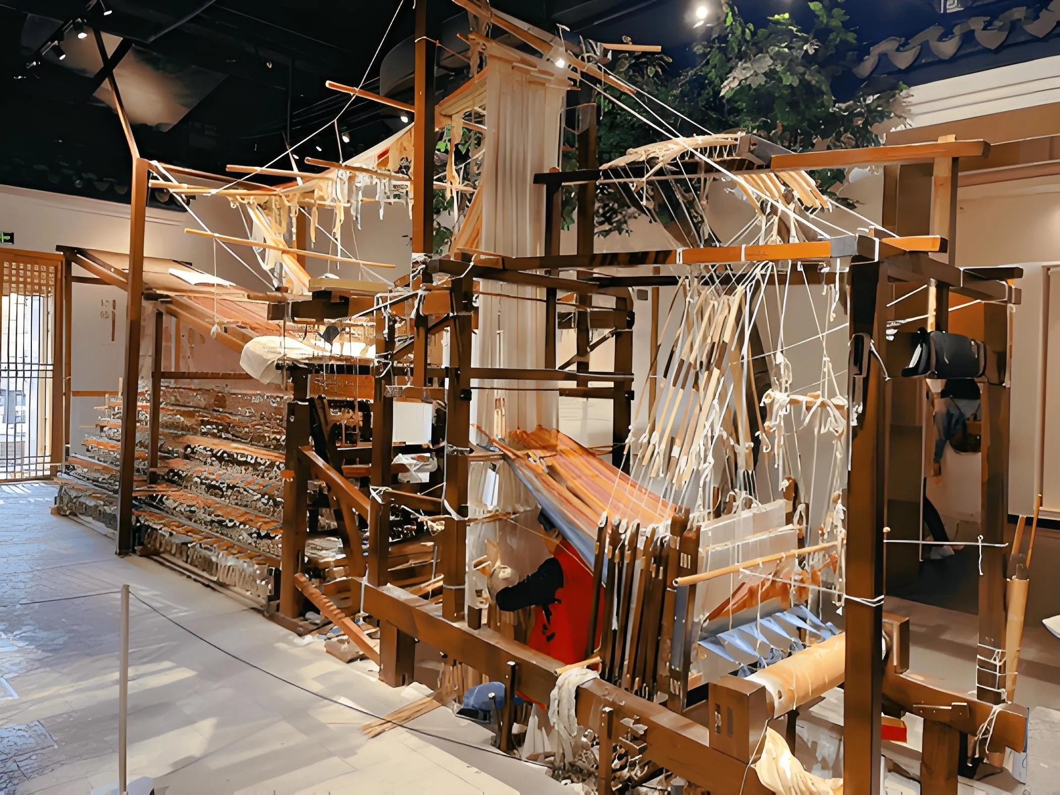 A complex traditional wooden drawloom showcasing authentic heritage Suzhou silk weaving craftsmanship.