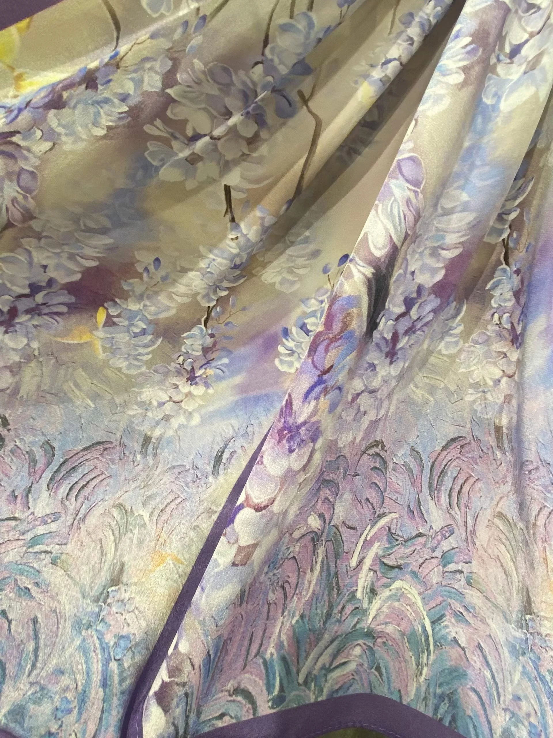100% natural Mulberry silk fabric featuring an Impressionist purple wisteria floral pattern, showcasing heritage Suzhou sericulture craftsmanship.