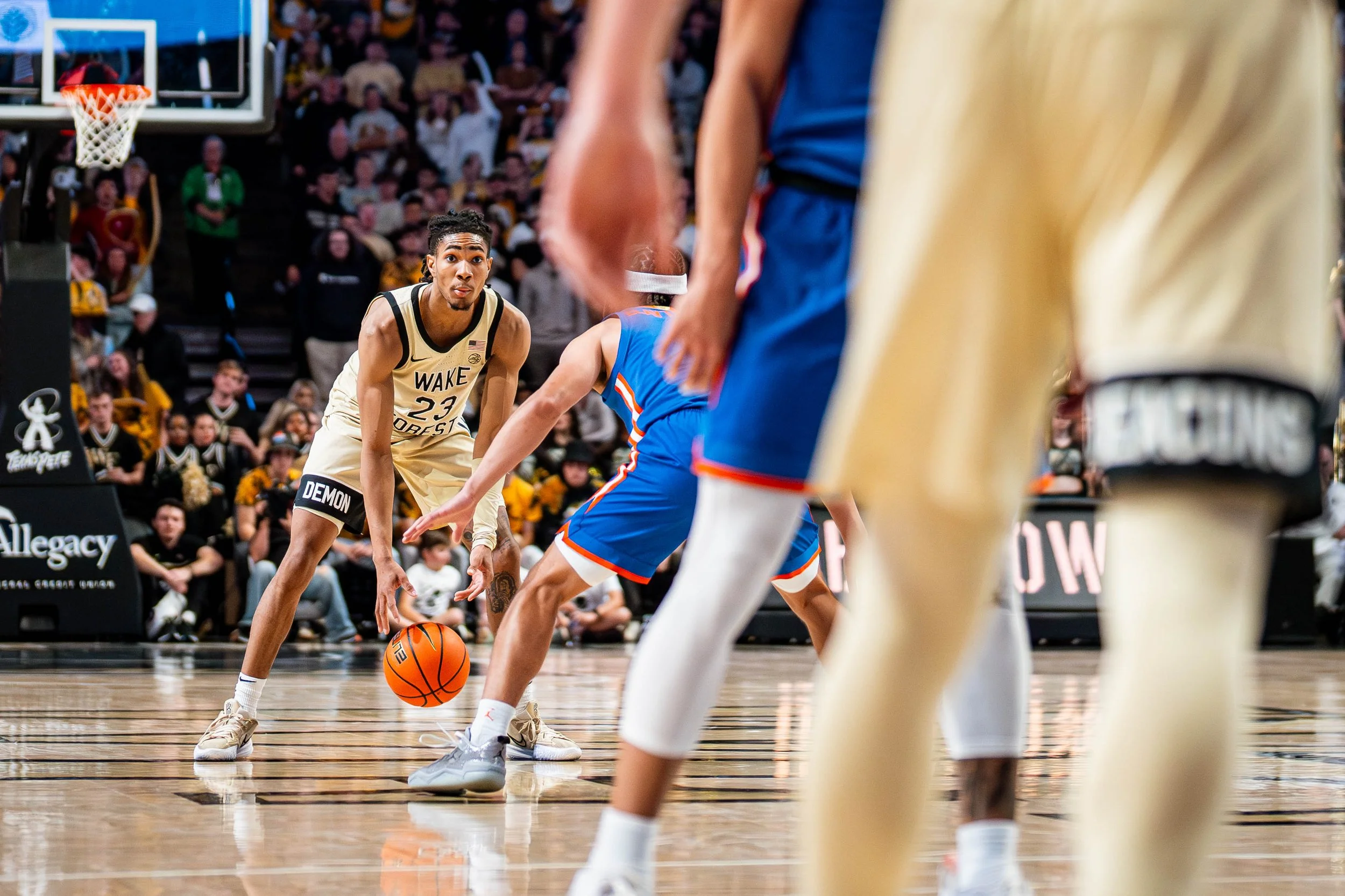 Basketball player from Wake Forest University dribbles the ball during a game