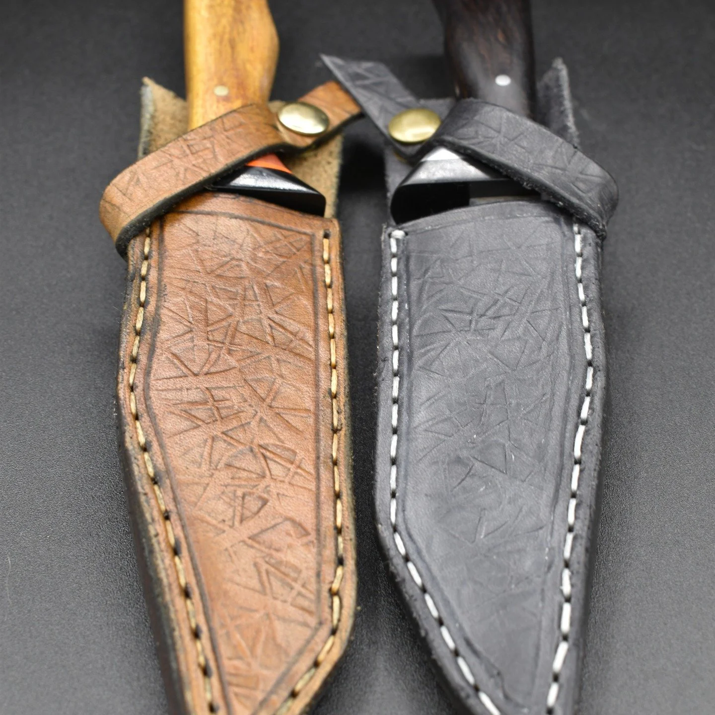 A sister pair of san mai knives made, for the owners of Spirit Flame, as thanks for letting me show my knives. 
Black and silver (Ebony and steel) for Nia. Yellow, orange, and pink (Canary Wood, Pink Ivory, and G10.) Made from the same billet, split