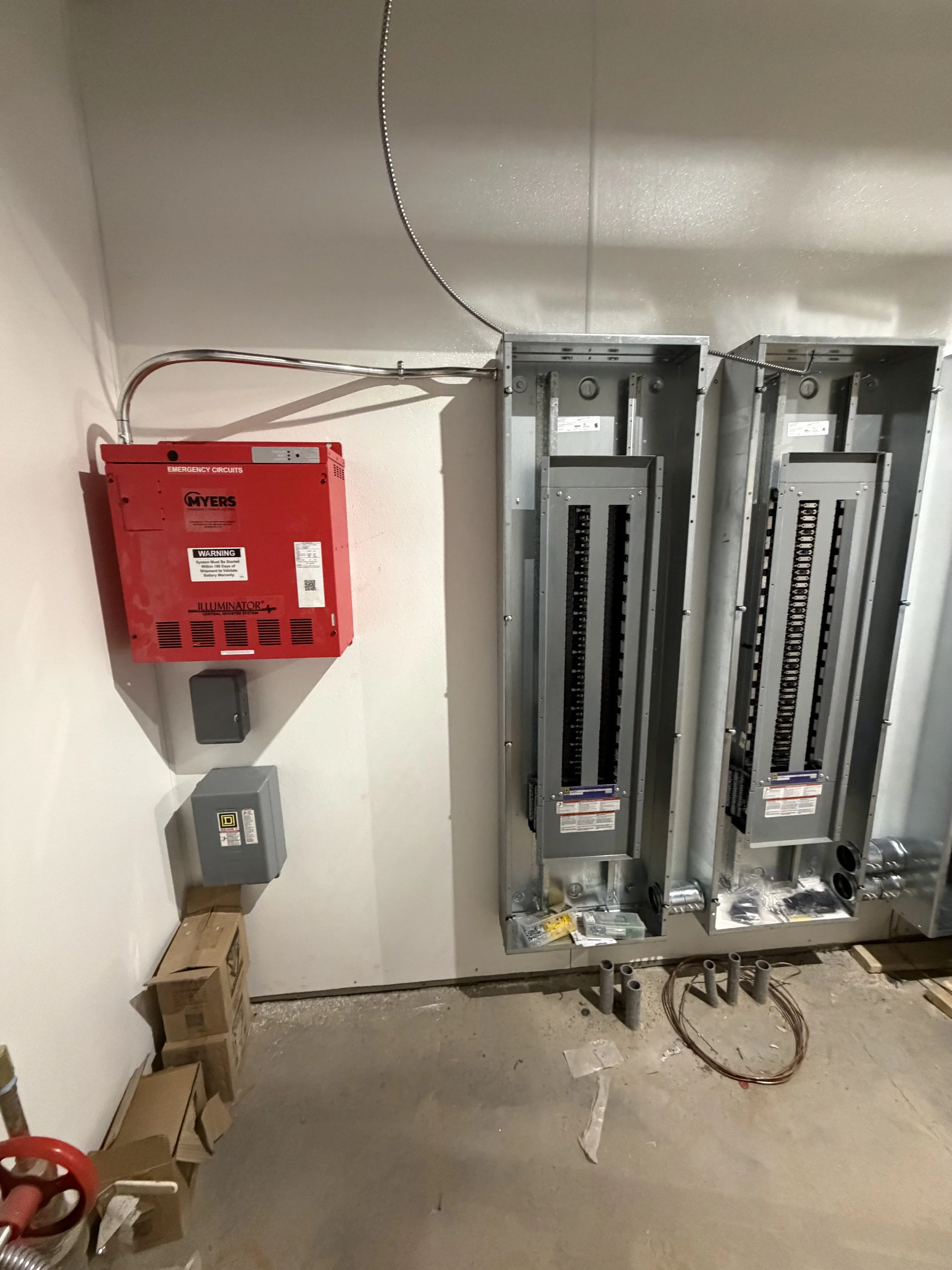 Commercial electrical panel installation and fire alarm equipment completed by Crone Electric for a new construction project in Arizona.