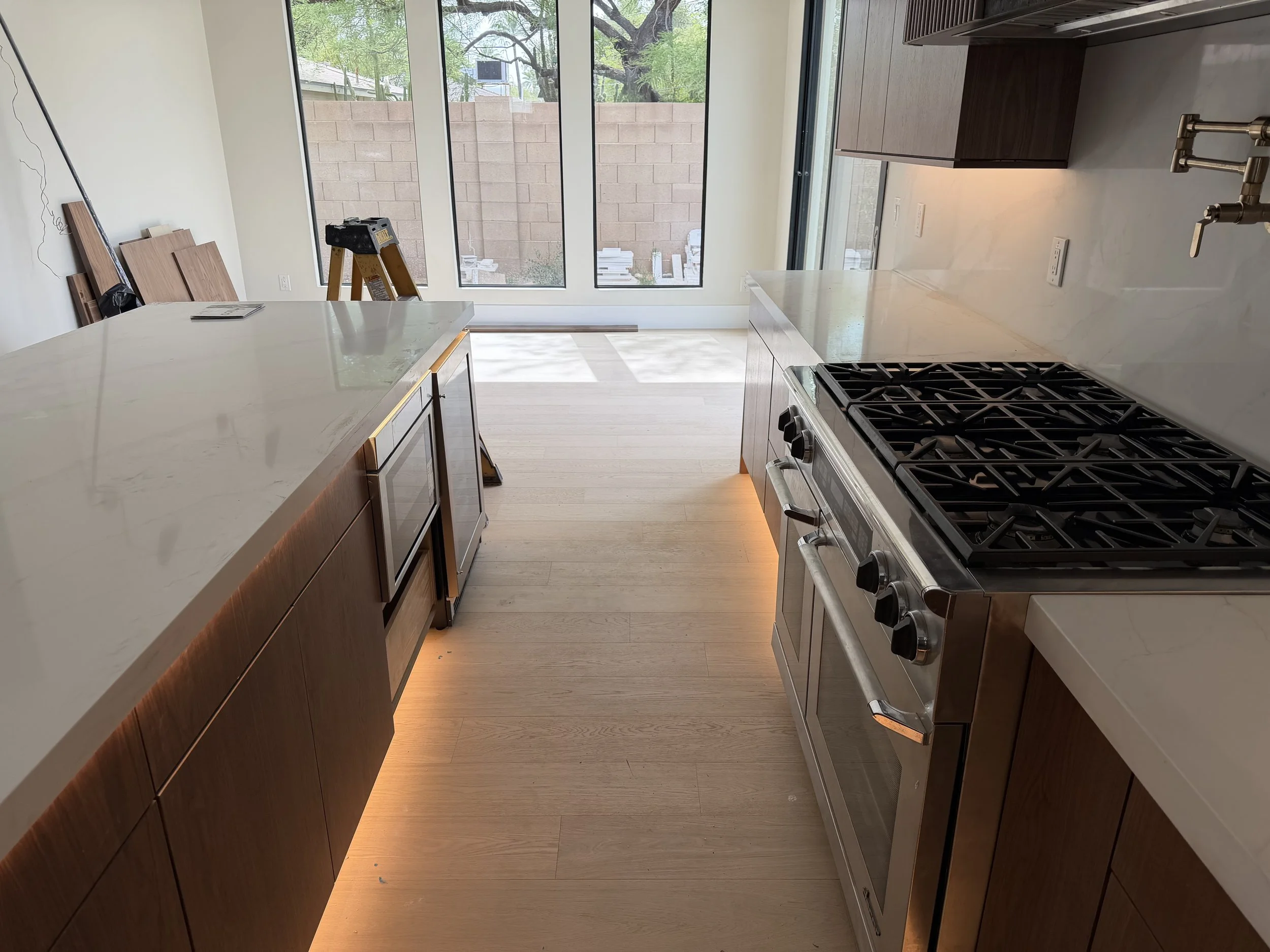 Modern custom kitchen with under-cabinet lighting installed by Crone Electric during a residential new construction project in Arizona.