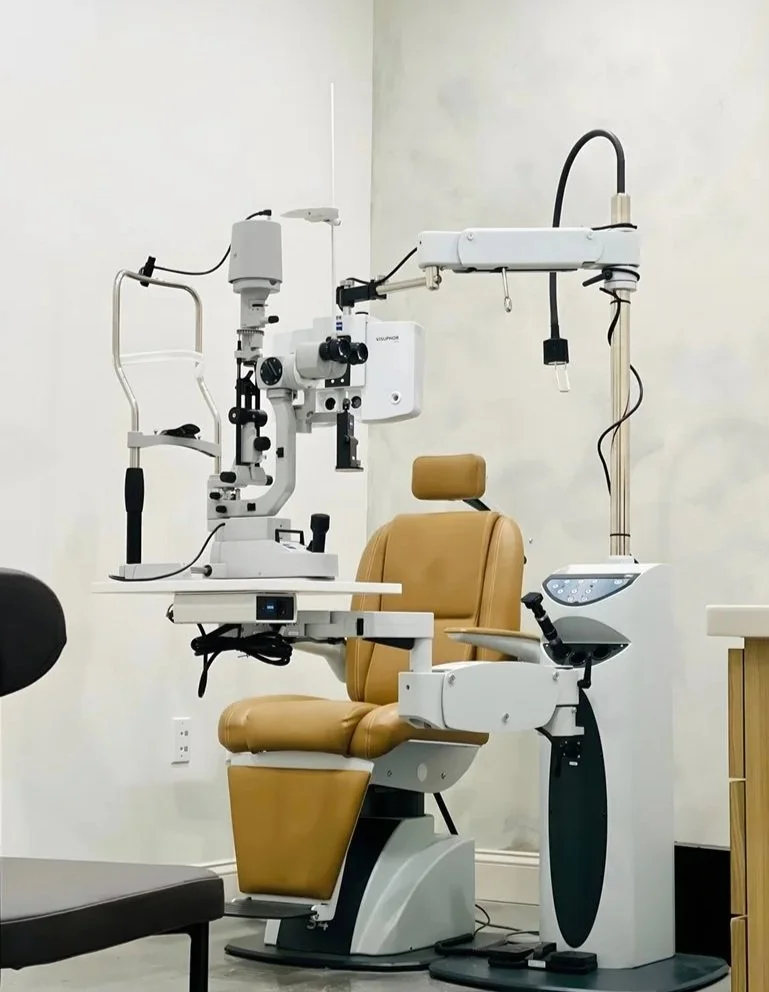Optometry examination chair and slit lamp in an optometrist's office.