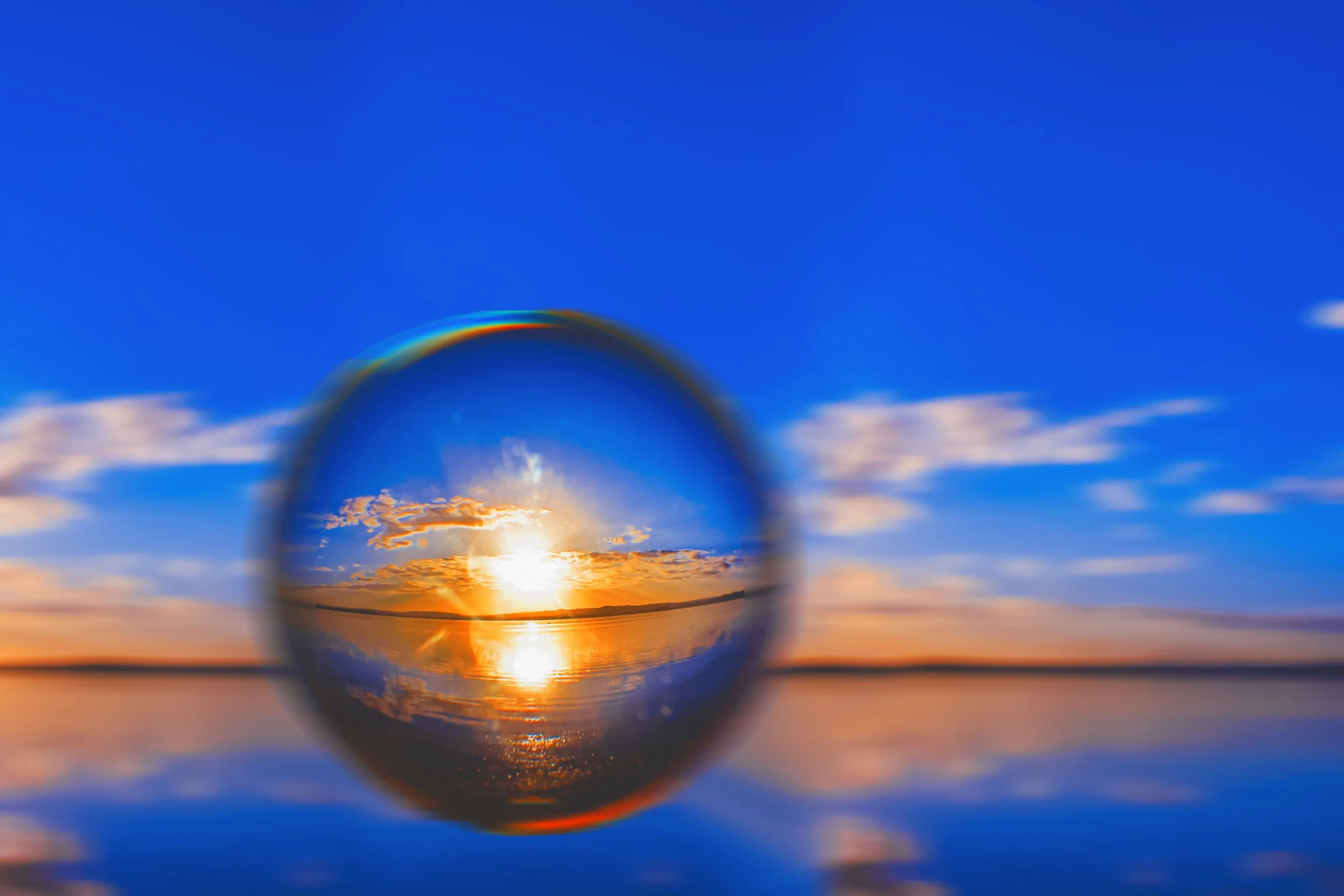 creative-lens-ball-photography-sunlight-horizon-with-clouds-around-blue-sky.jpg