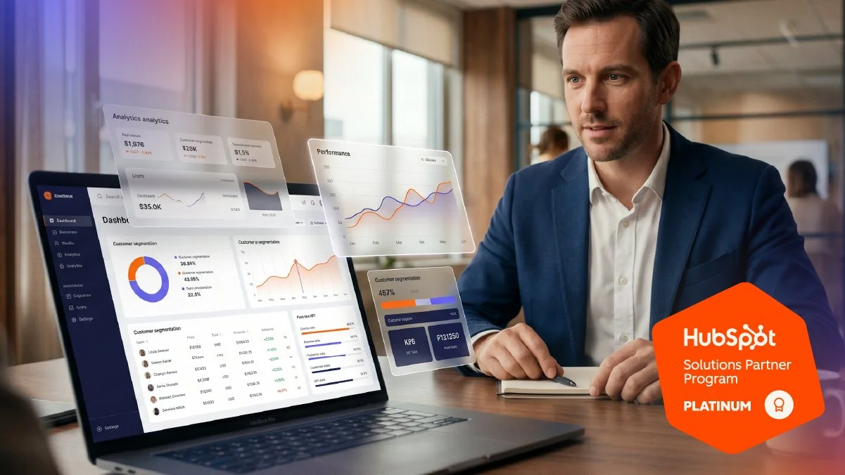 Business professional analyzing HubSpot CRM analytics and automation dashboards, alongside HubSpot Platinum Partner branding, representing strategic CRM implementation and scalable business growth.
