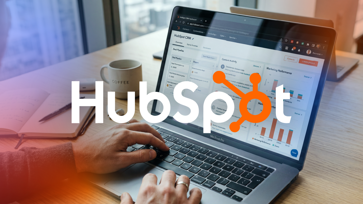 Professional working within the HubSpot CRM platform on a laptop, representing the initial stage of HubSpot implementation and the foundation for building structured commercial operations.