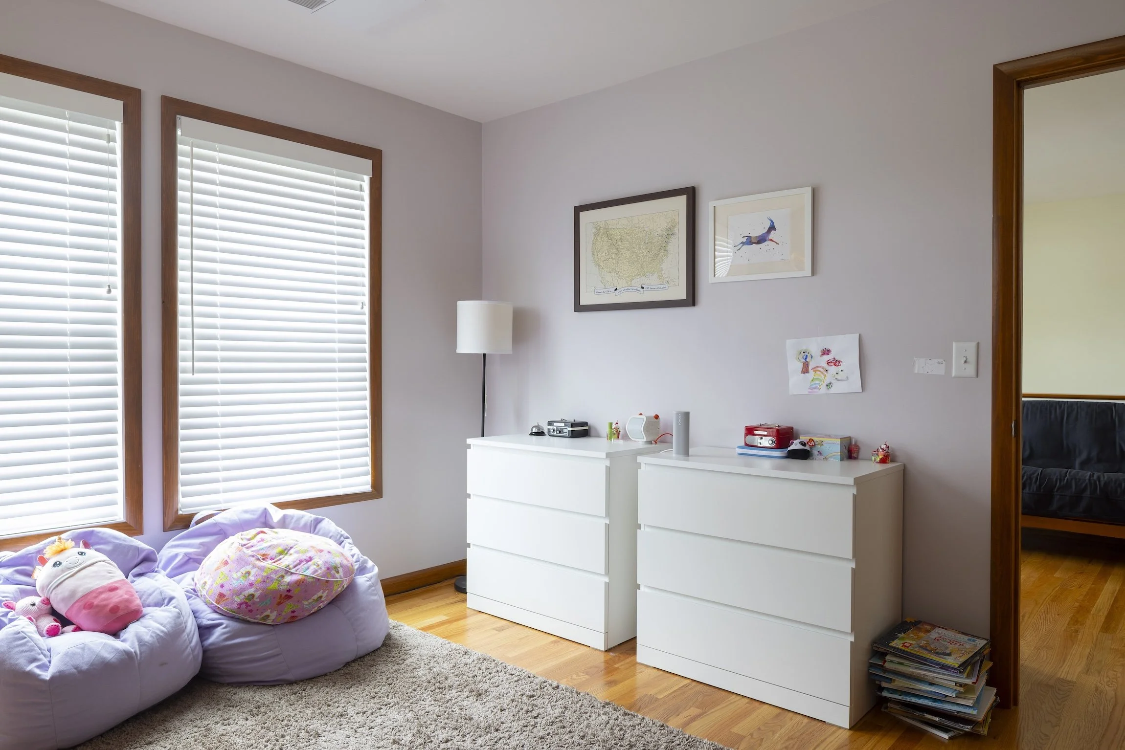 A pale violet tints this sisters' bedroom...