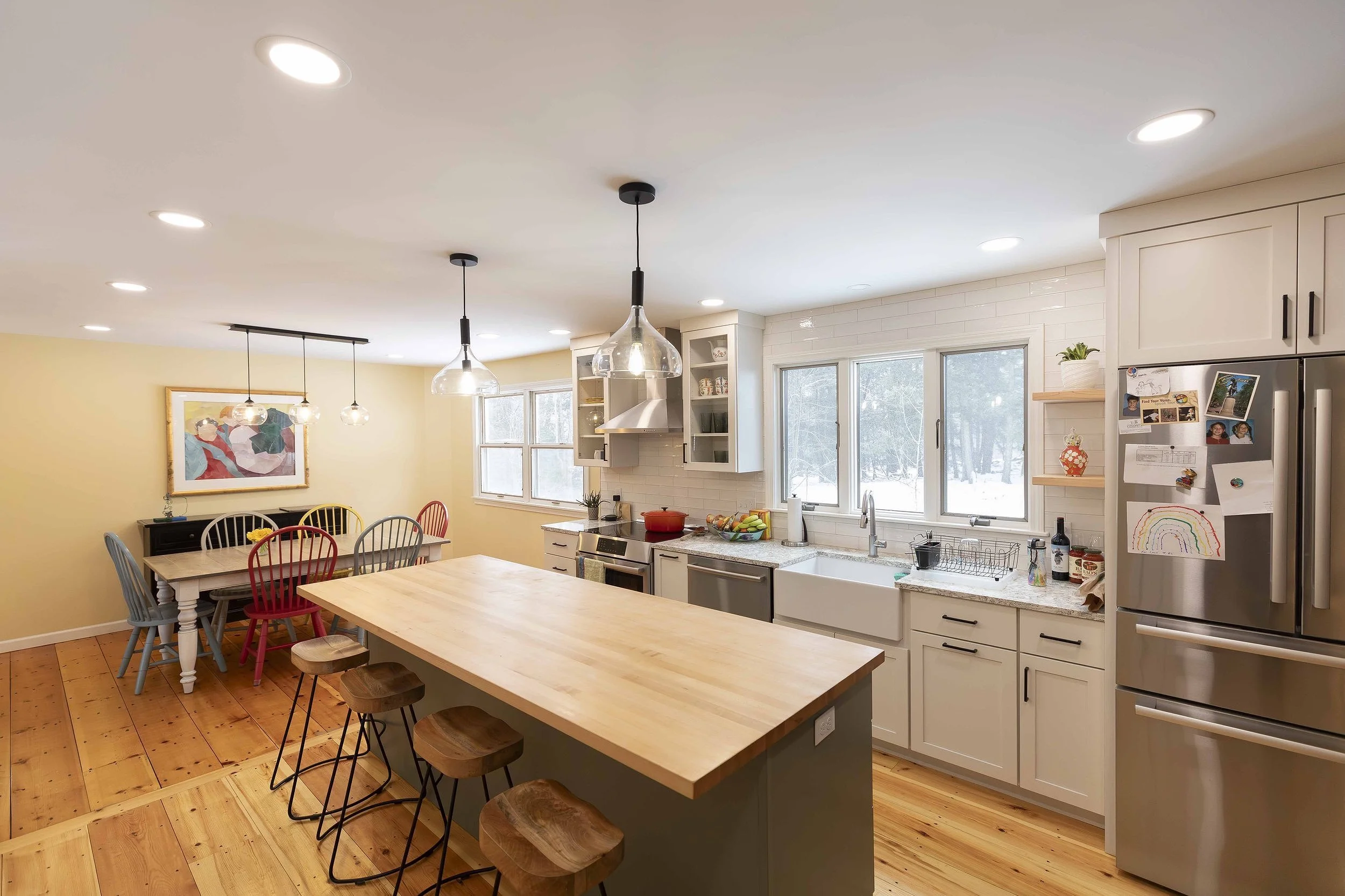 A creamy yellow creates a comfortable family kitchen.