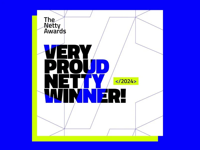 Design announcing the Netty Awards 2024, with the message "Very Proud Netty Winner!" in bold letters against a white background with geometric lines, bordered by bright yellow and green, and set against a blue backdrop.