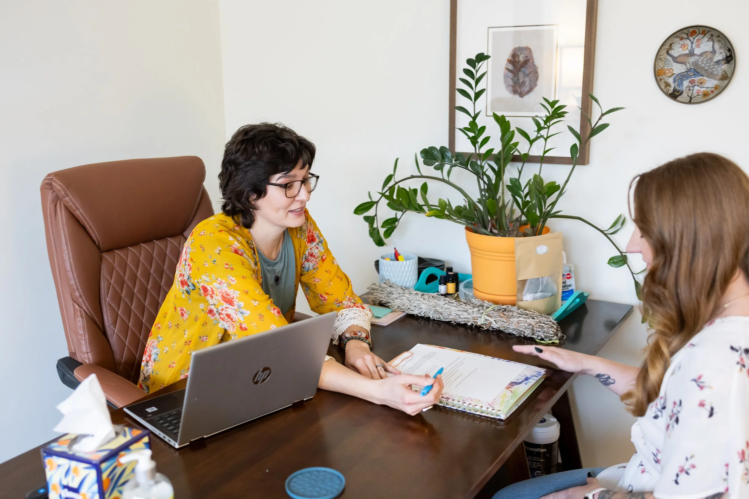 Dr. Bobi Farrow reviewing treatment plan and lab results with a client, Lincoln, Nebraska