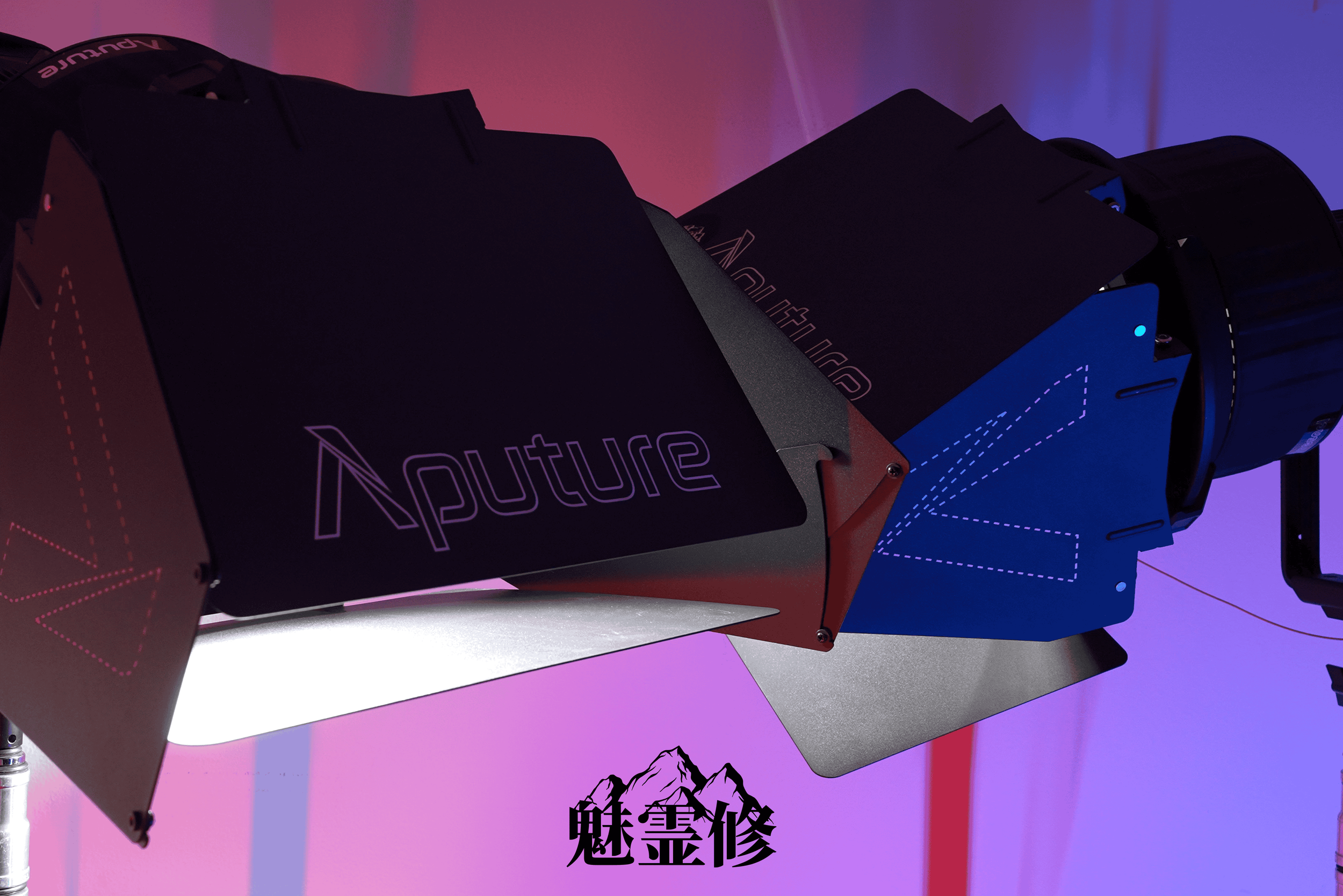 Close-up of black box with colorful laser lines and text, against pink and blue background, with Chinese characters and mountain graphic.