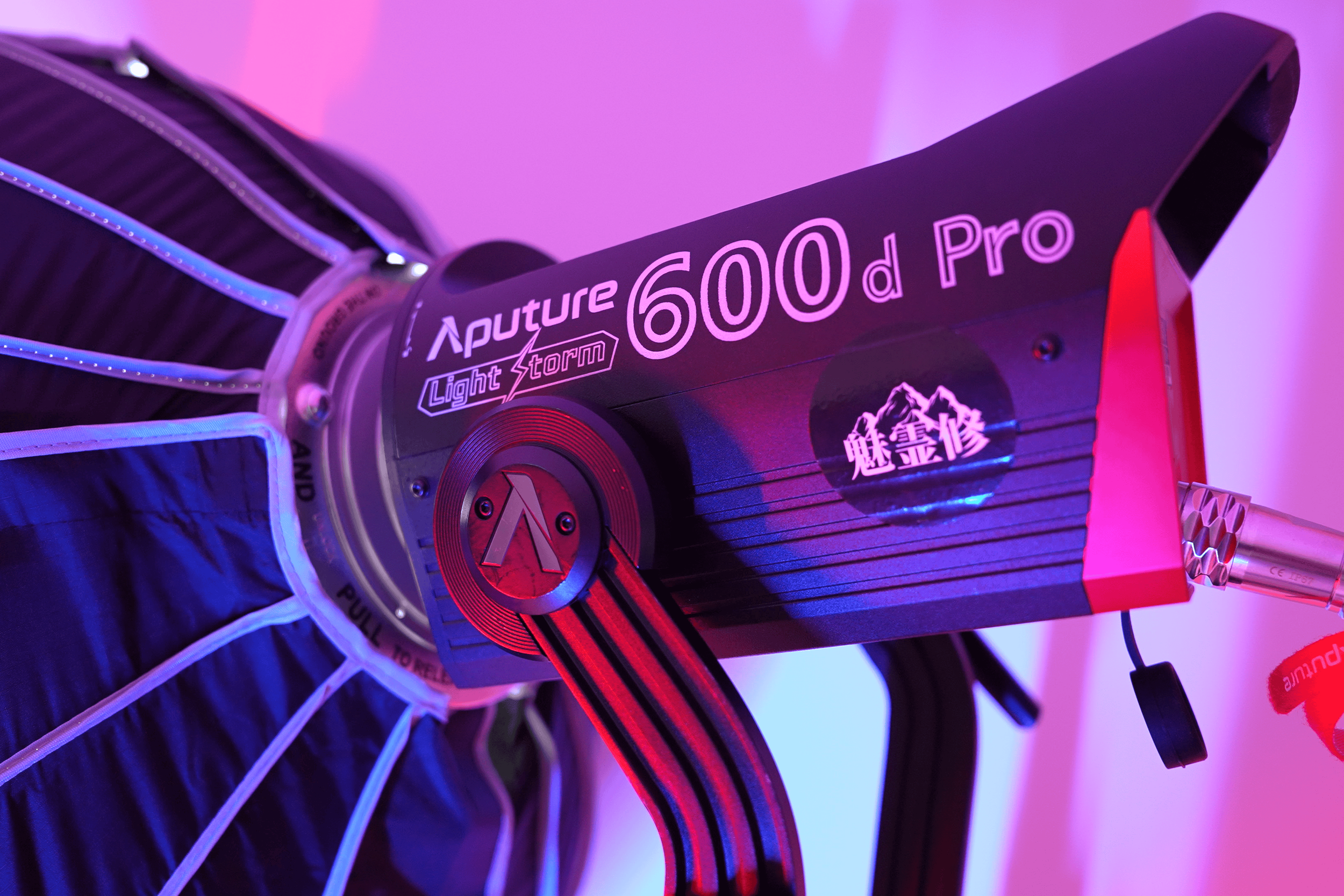 Aputure LS 600d Pro lighting equipment for film and video production with purple and pink studio lighting.