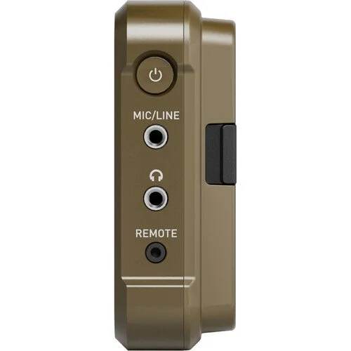 Close-up of a beige electronic device with a power button, two audio jacks labeled MIC/LINE and REMOTE, and a black side switch.