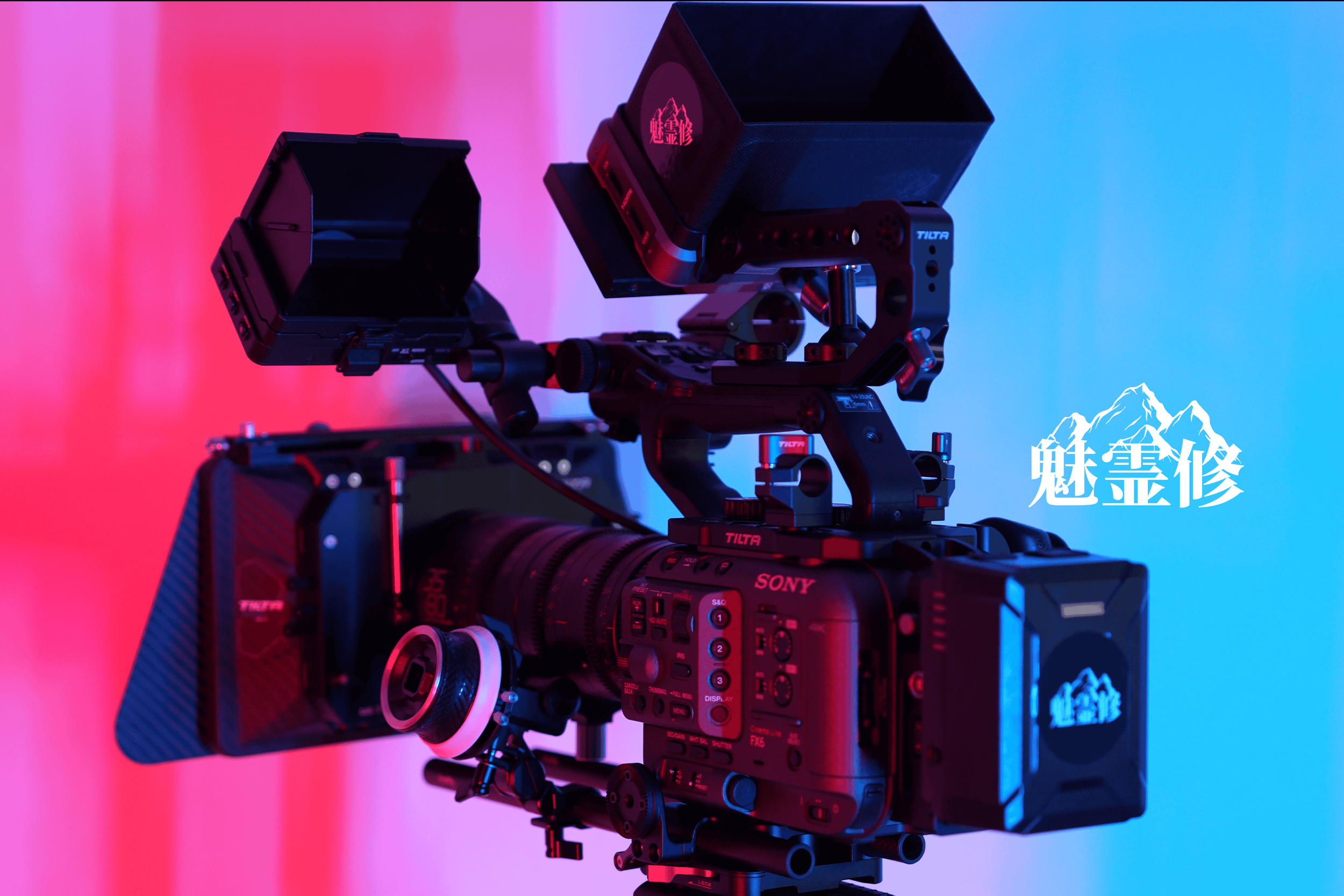 Professional video camera mounted on a rig with blue and pink lighting and white Chinese characters and mountain logo