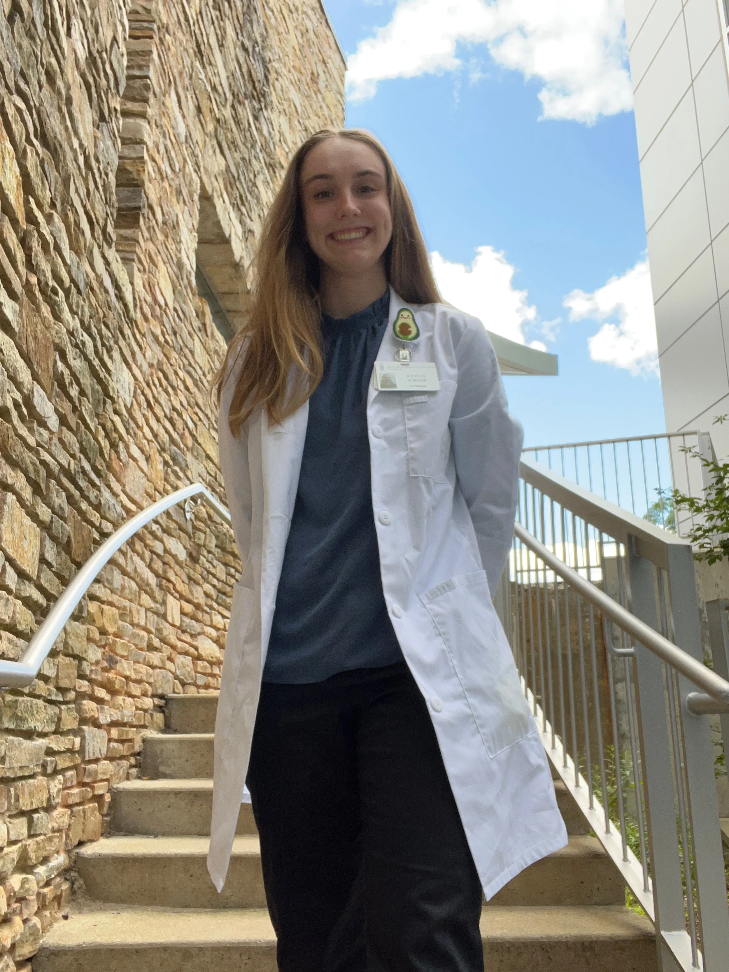 Picture of Kaylee Porter, in a Lab Coat outdoors.