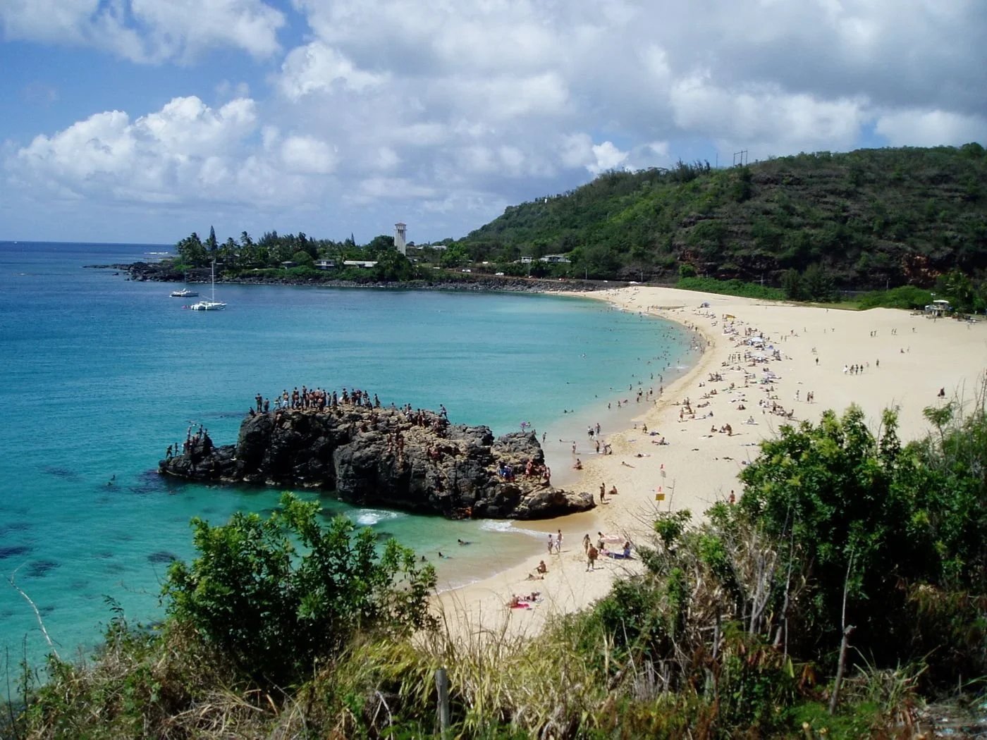 Waimea Bay on Oʻahu&rsquo;s North Shore is a legendary beach known for its massive winter waves and calm, crystal-clear waters in the summer. 

During winter months, it becomes a world-famous big wave surfing spot where waves can reach incredible hei
