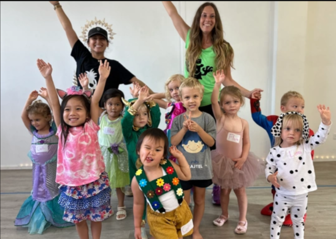 children in dance outfits posing