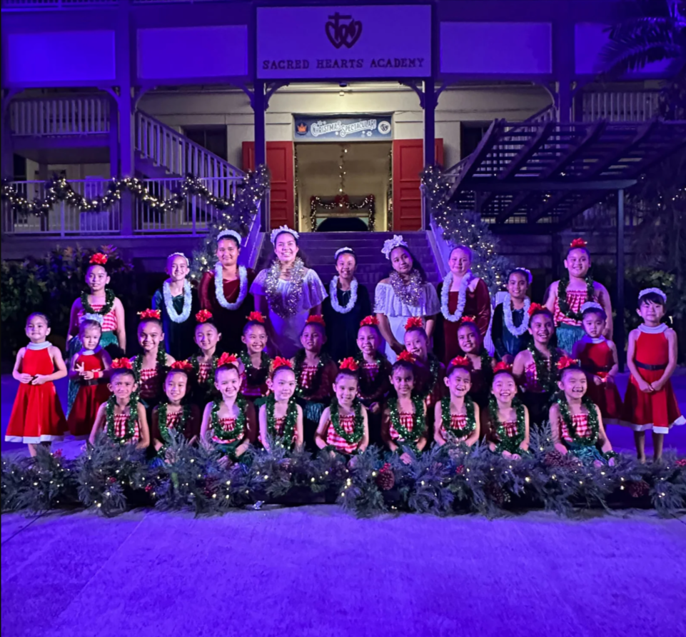 Children in Santa Outfits and Lays posing for a photo