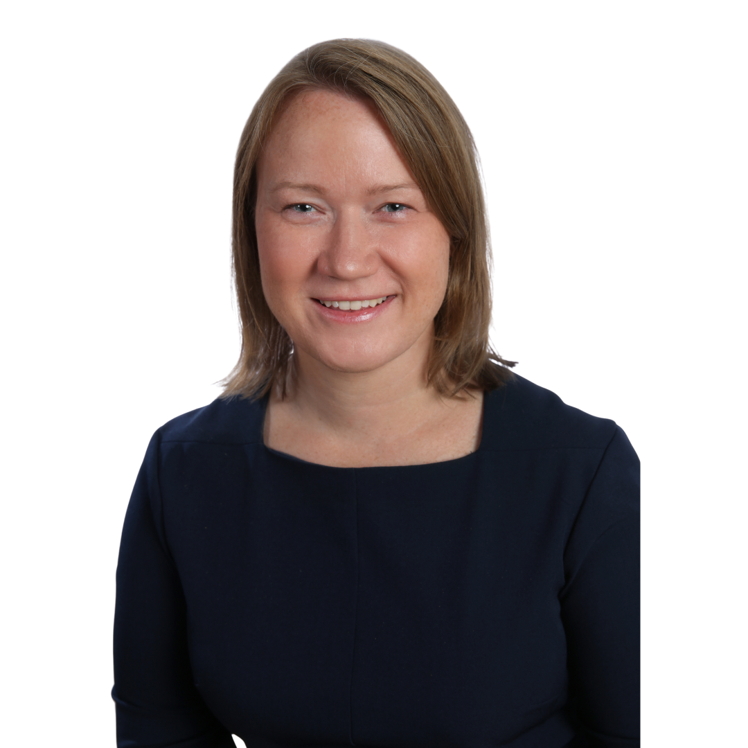 Portrait of a smiling woman with shoulder-length brown hair wearing a navy blue top against a white background.