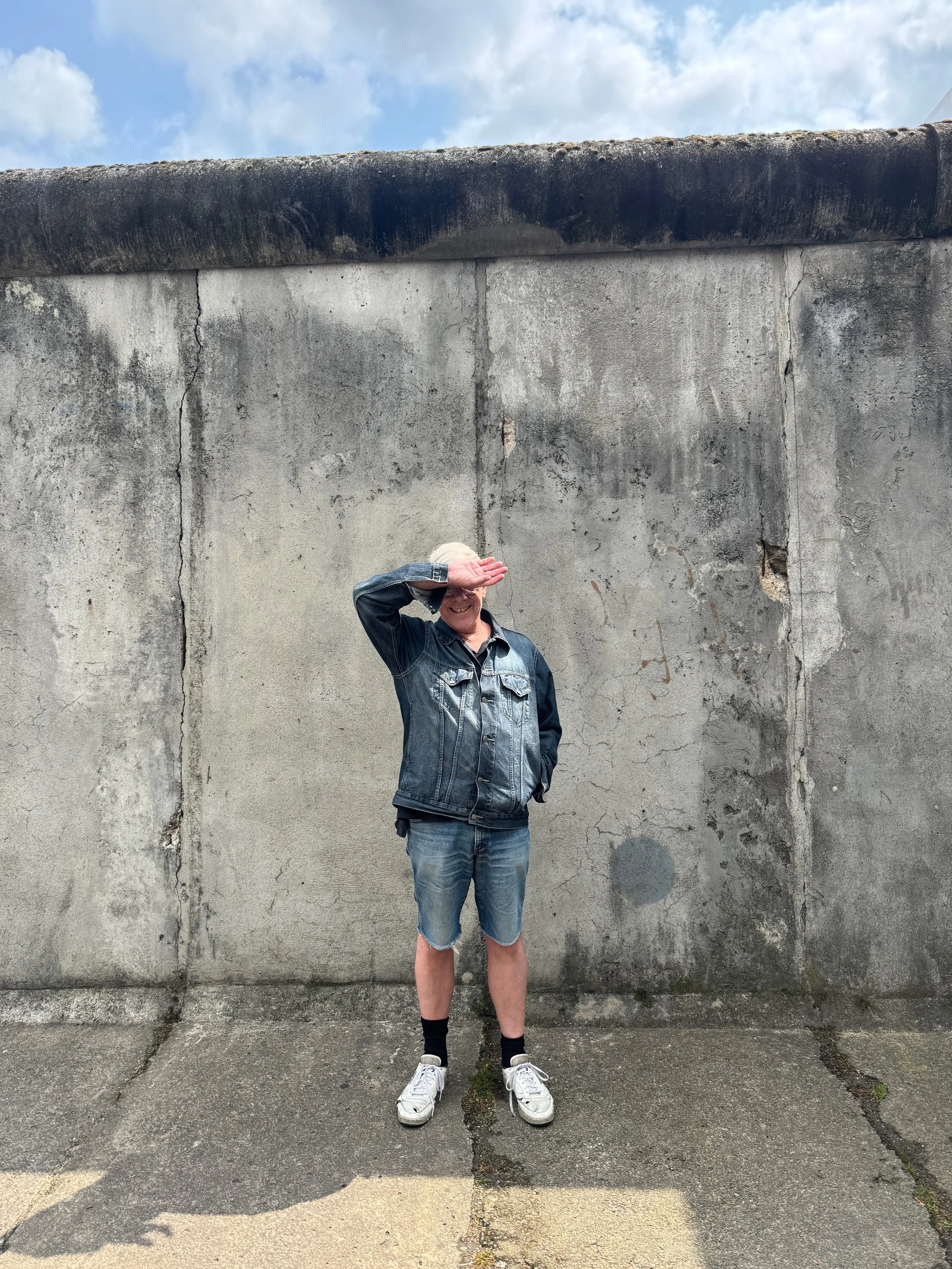 Karl Holmqvist with the Berlin Wall. Photo by Lukas Panek.jpeg